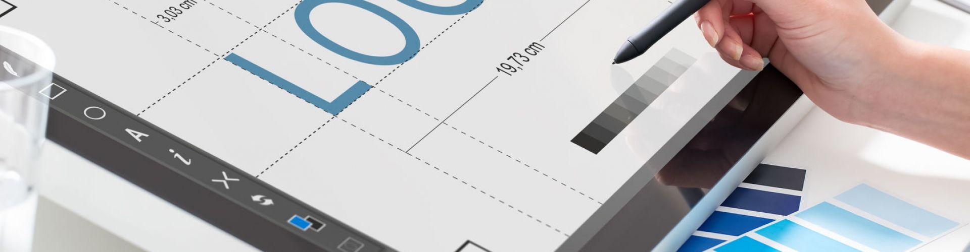Graphic designer at work. Color samples.